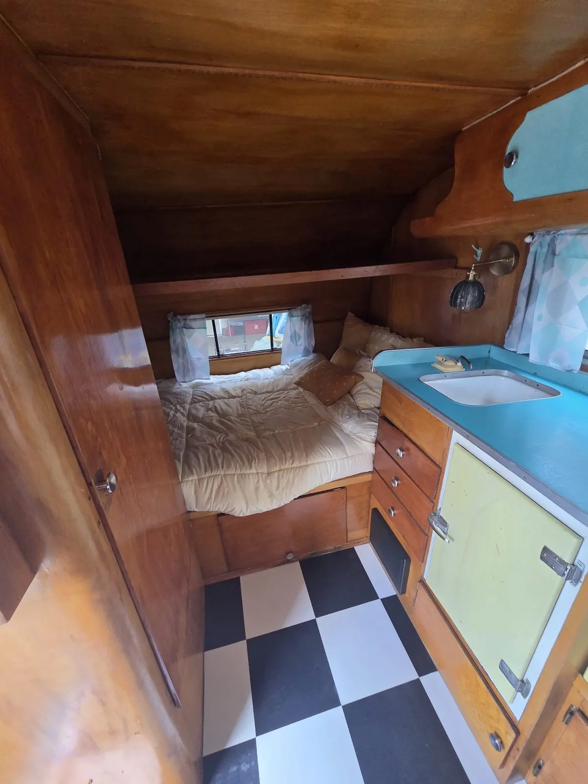 Sleeping area beside the sink cabinet.