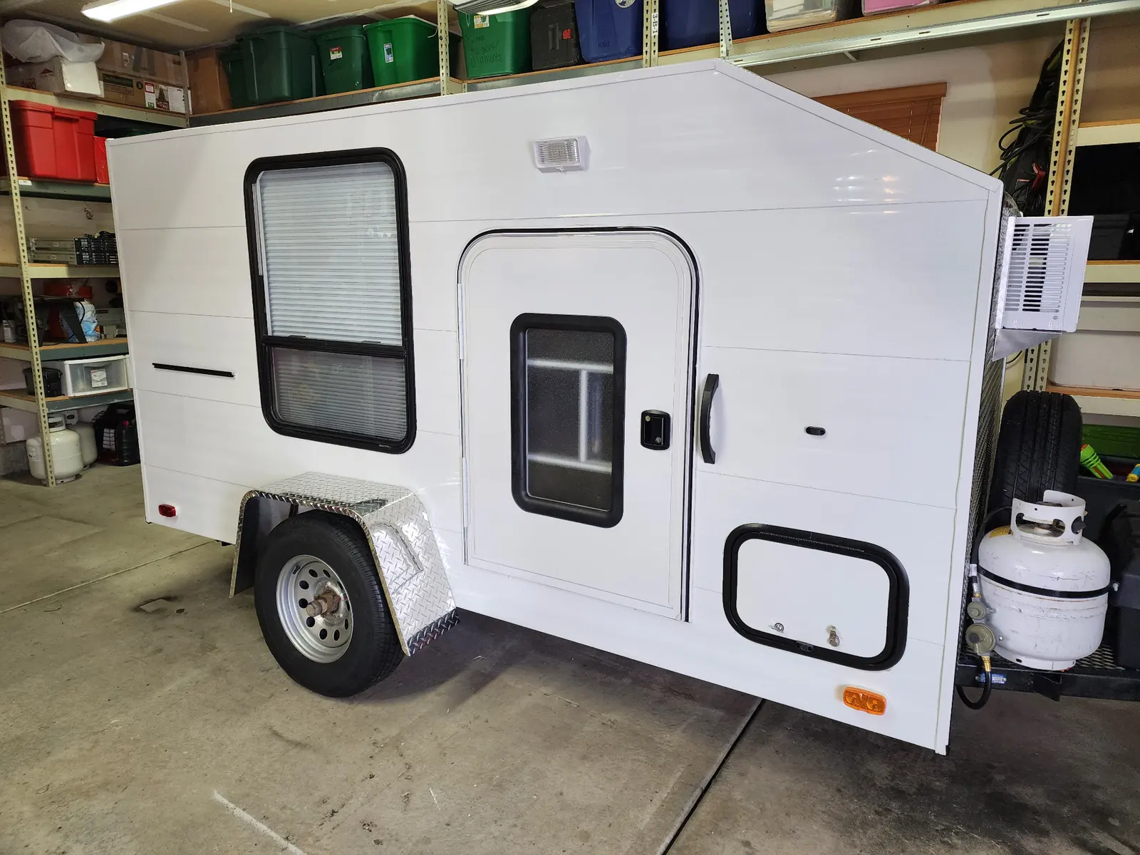 Finished camper viewed from the door-side corner.