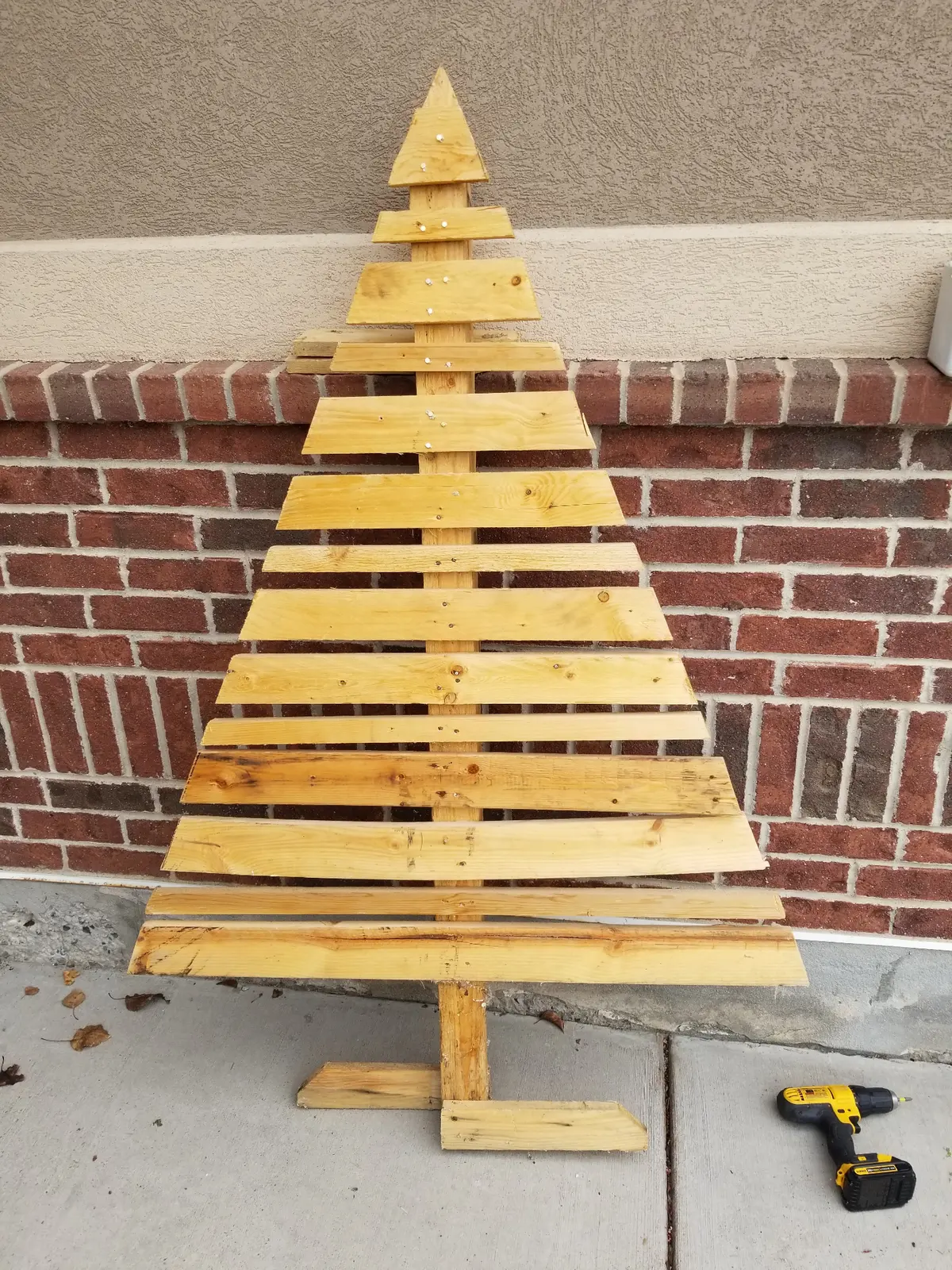 Assembled wooden slat tree before painting.