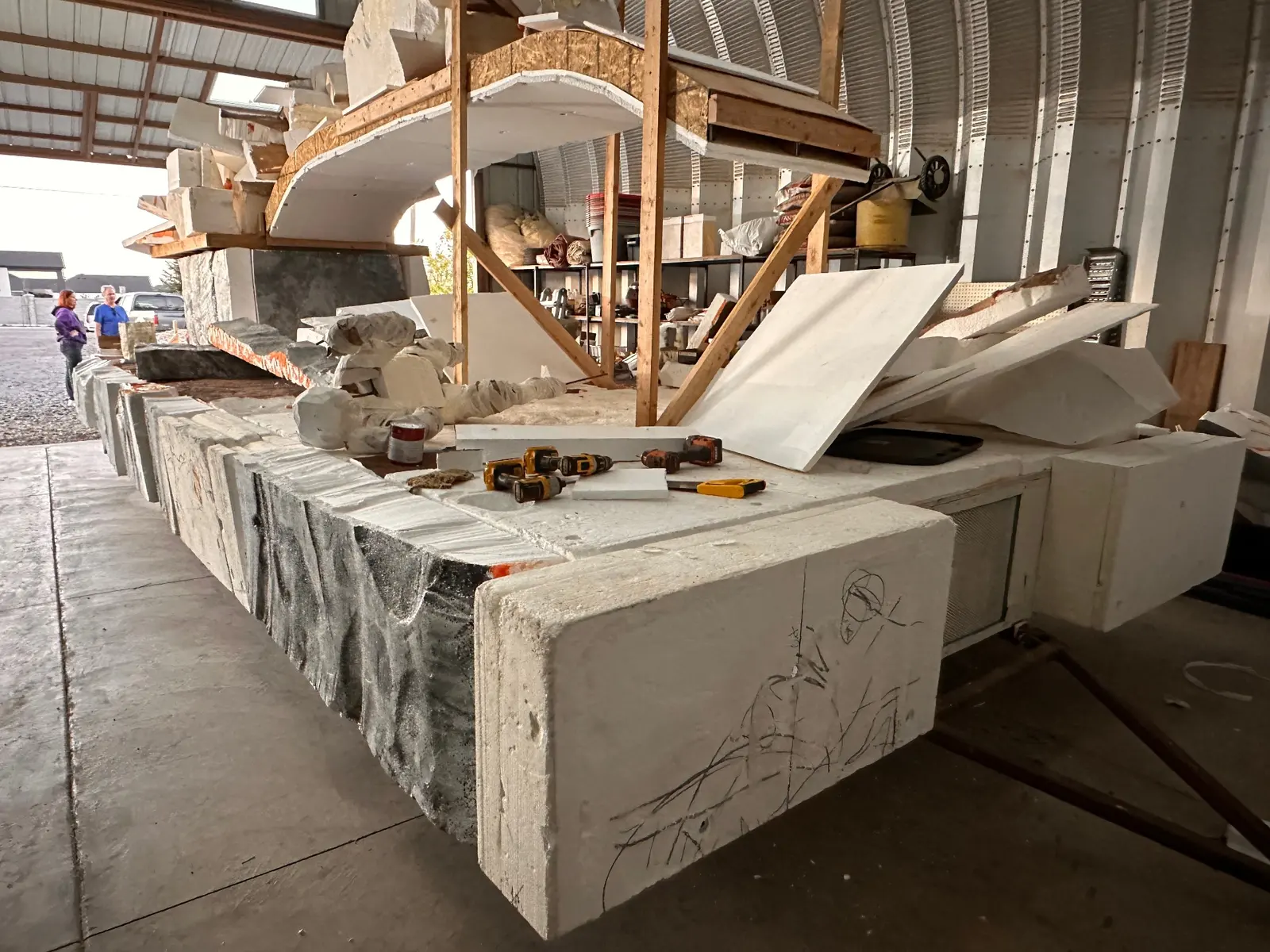Parade float construction showing arched temple structure on trailer
