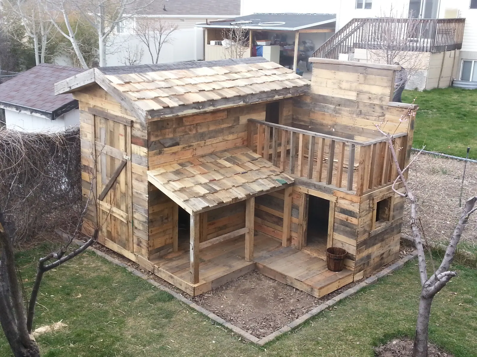Western pallet playhouse complete with upper deck and stairs