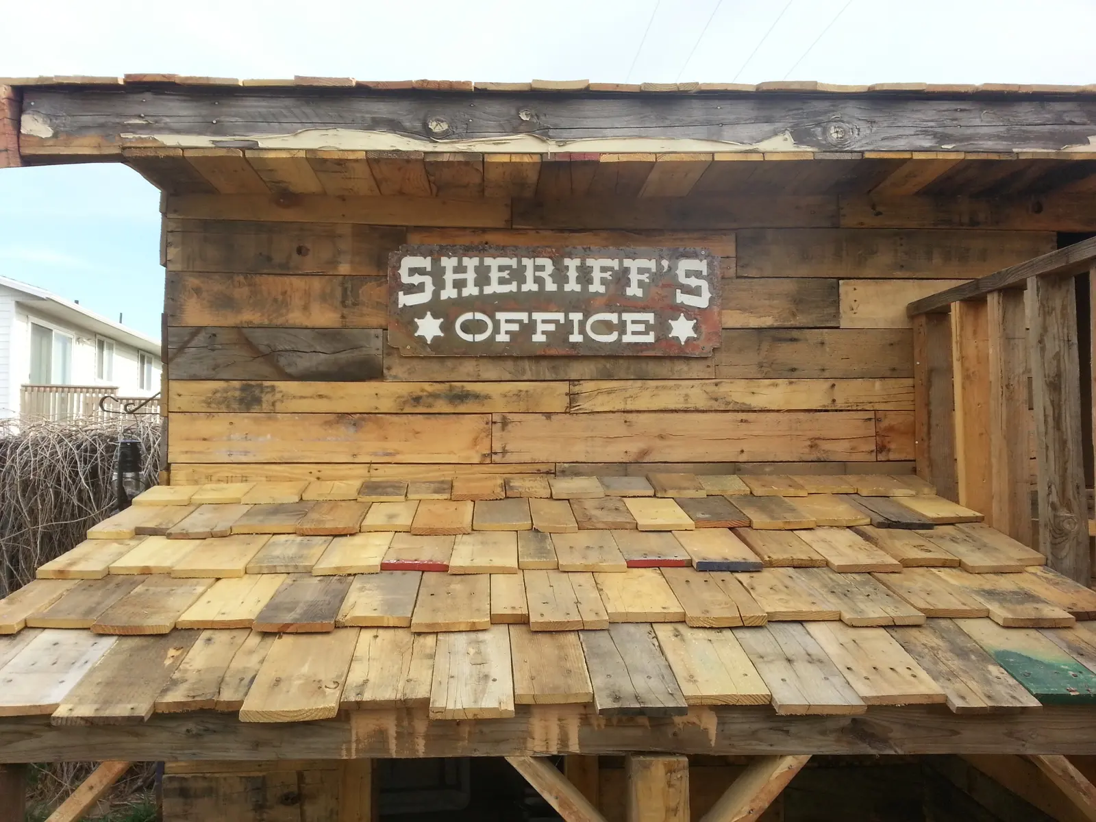 Western pallet playhouse detail view showing construction quality