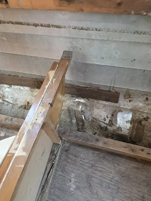 Opened wall and bench framing during restoration.