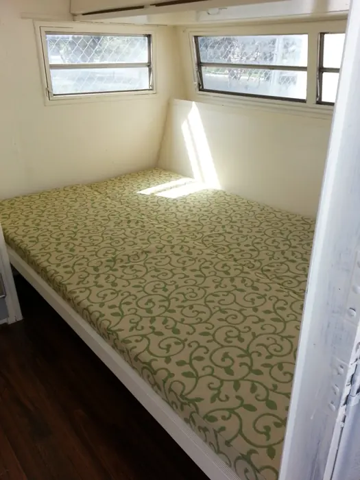 Dinette cushions arranged as a bed.