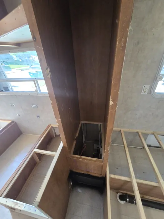 Interior dismantling around the cabinets and benches.