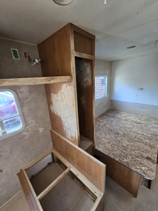 Exposed interior and bench framing during the rebuild.