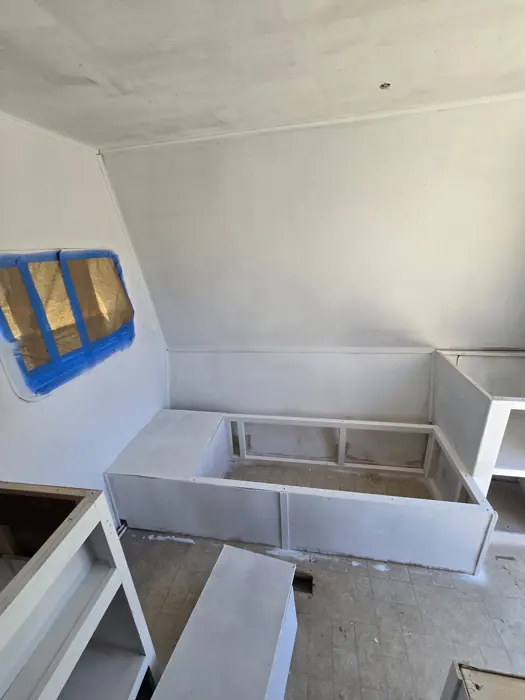 Painted bench frames before the seating was fitted.