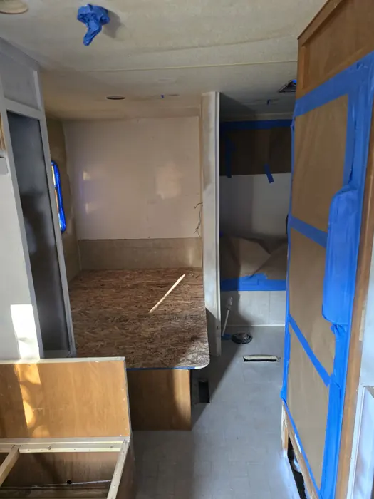 Bathroom and doorway masked for painting.