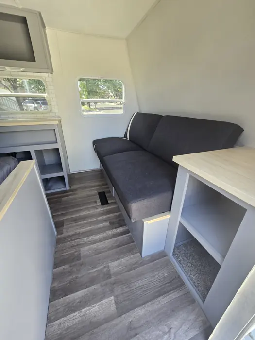 New flooring fitted beside the sofa and galley.
