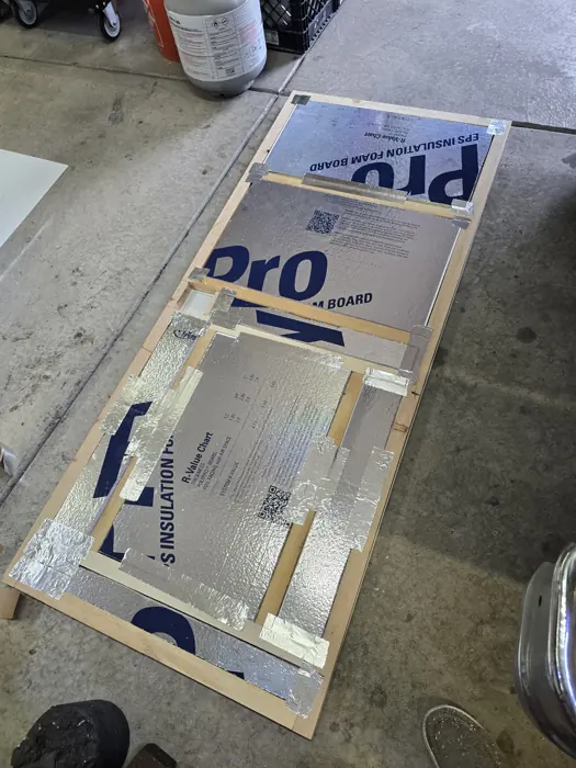 Insulation fitted inside the replacement door.