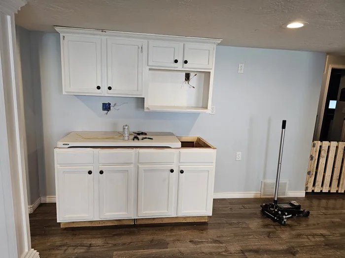 White base and wall cabinets installed before the finished countertop.