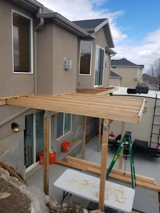 New deck frame extending along the back of the house.