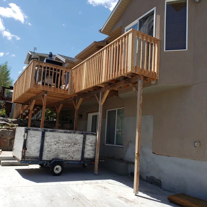 Side view showing the full length of the rebuilt deck and its supporting posts.