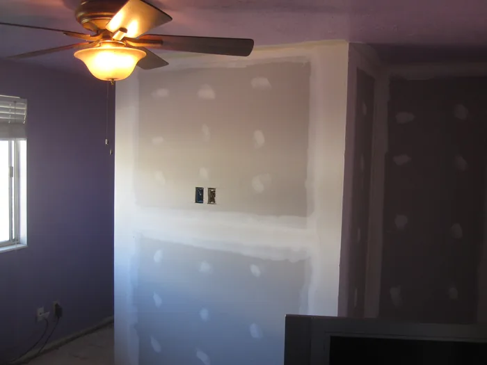 Bedroom wall patching and preparation before the new finish.