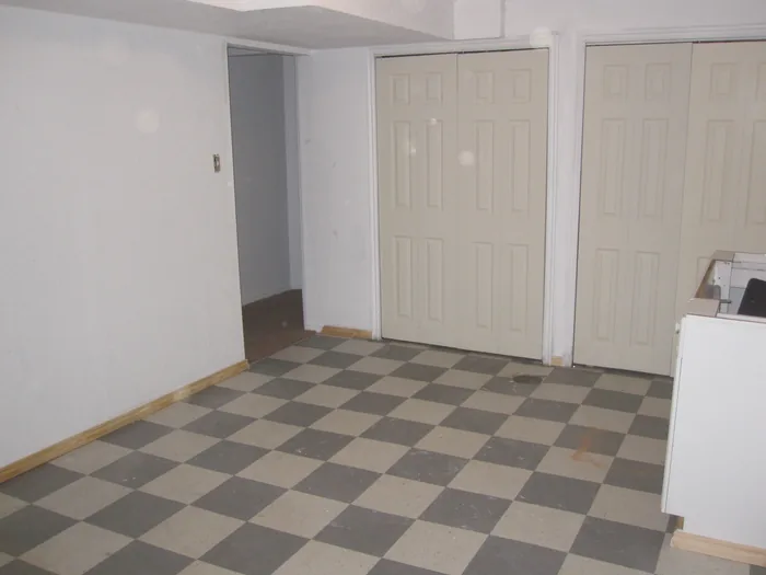 Basement kitchen and adjoining space during the room refresh.