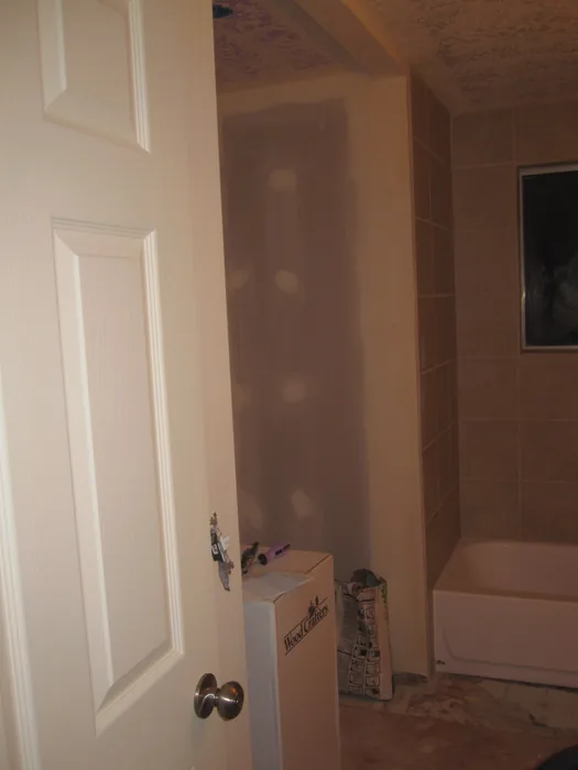 Bathroom during wall repairs and interior preparation.