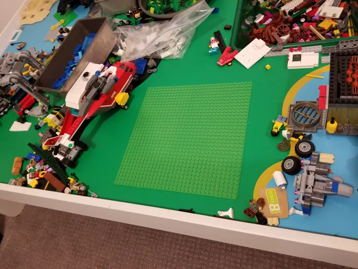 Lego baseplate area and completed models on the play table