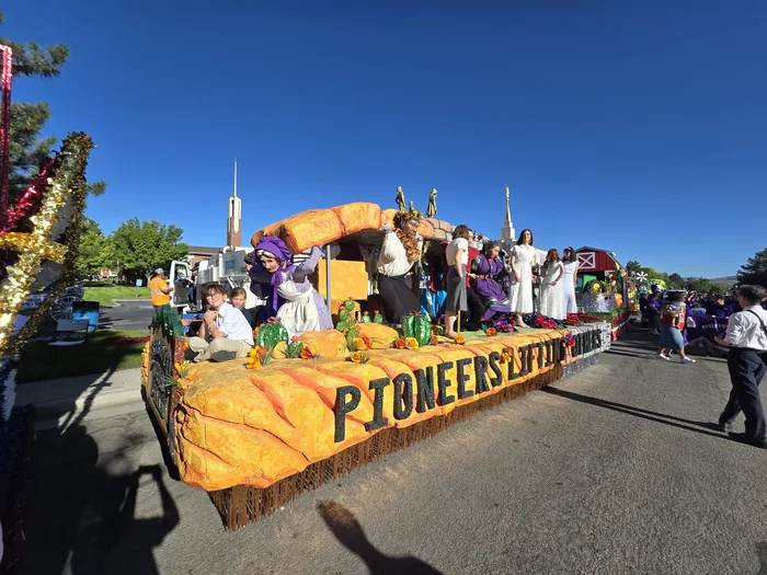 Completed parade float viewed from the opposite front corner, showing the full scenic structure.