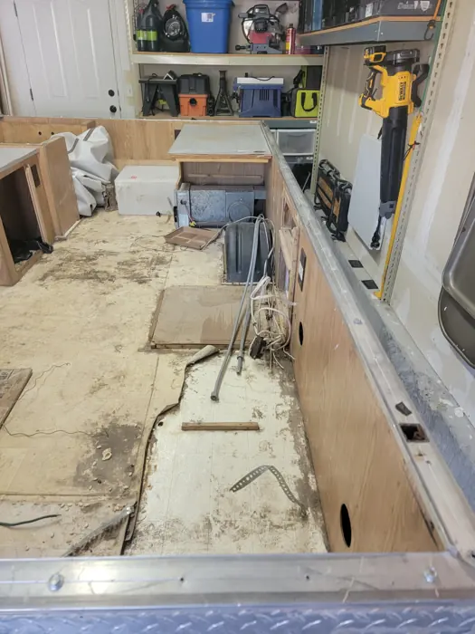 Original popup camper interior before dismantling.