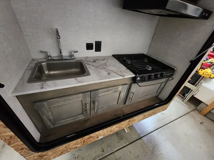 Rear galley installed beneath the open hatch.
