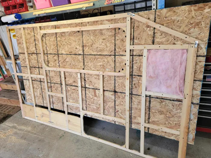 Insulation fitted between the wall studs.