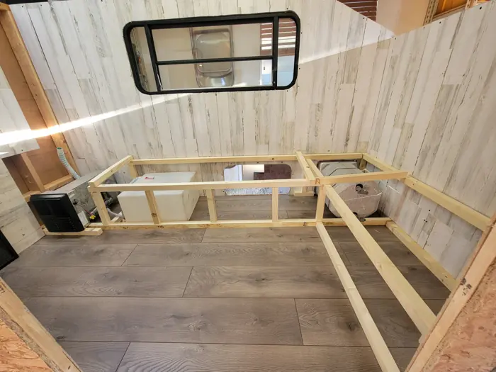 L-shaped seating frame under construction.