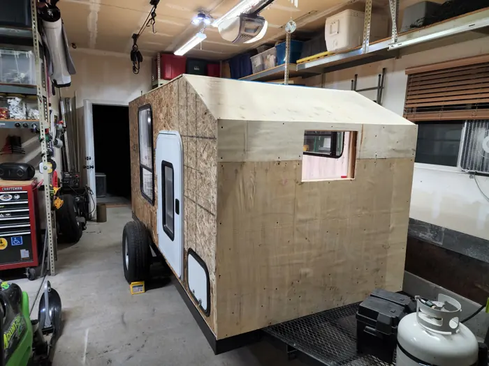 Camper body with the roof and wall sheathing fitted.