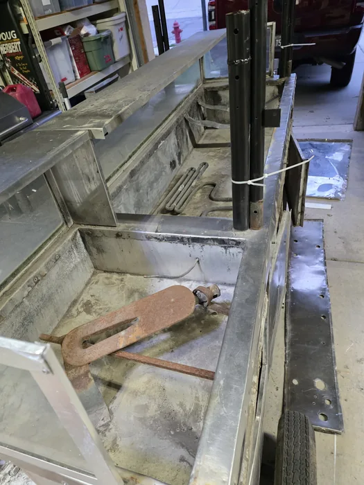 The cart opened up at the start of restoration, exposing the old work area.