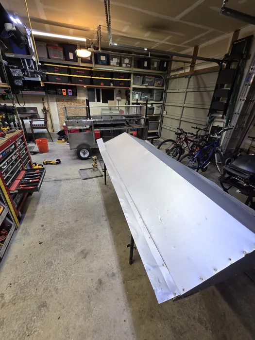 A new stainless work surface being prepared on stands in the workshop.