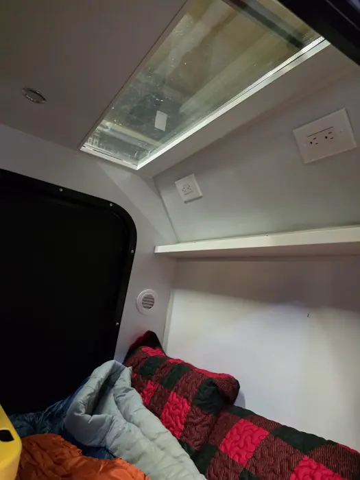 Opposite side of the sleeping cabin beneath the skylight.
