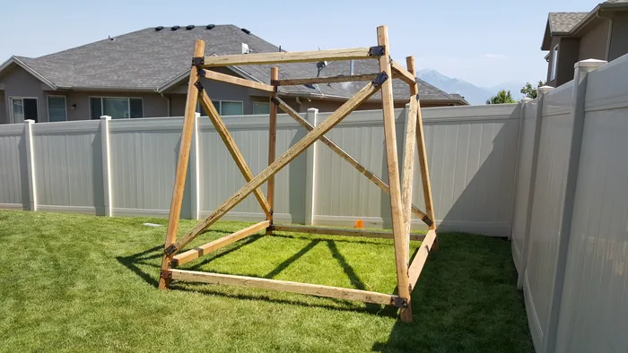 Raised timber frame for the fort standing in the backyard.